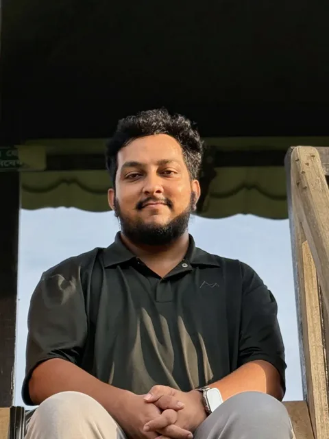 Tanzim Hossain Romel seated outdoors